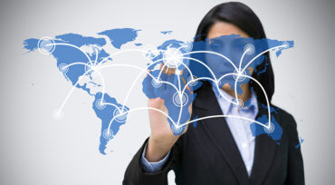 Woman behind a map connecting the countries